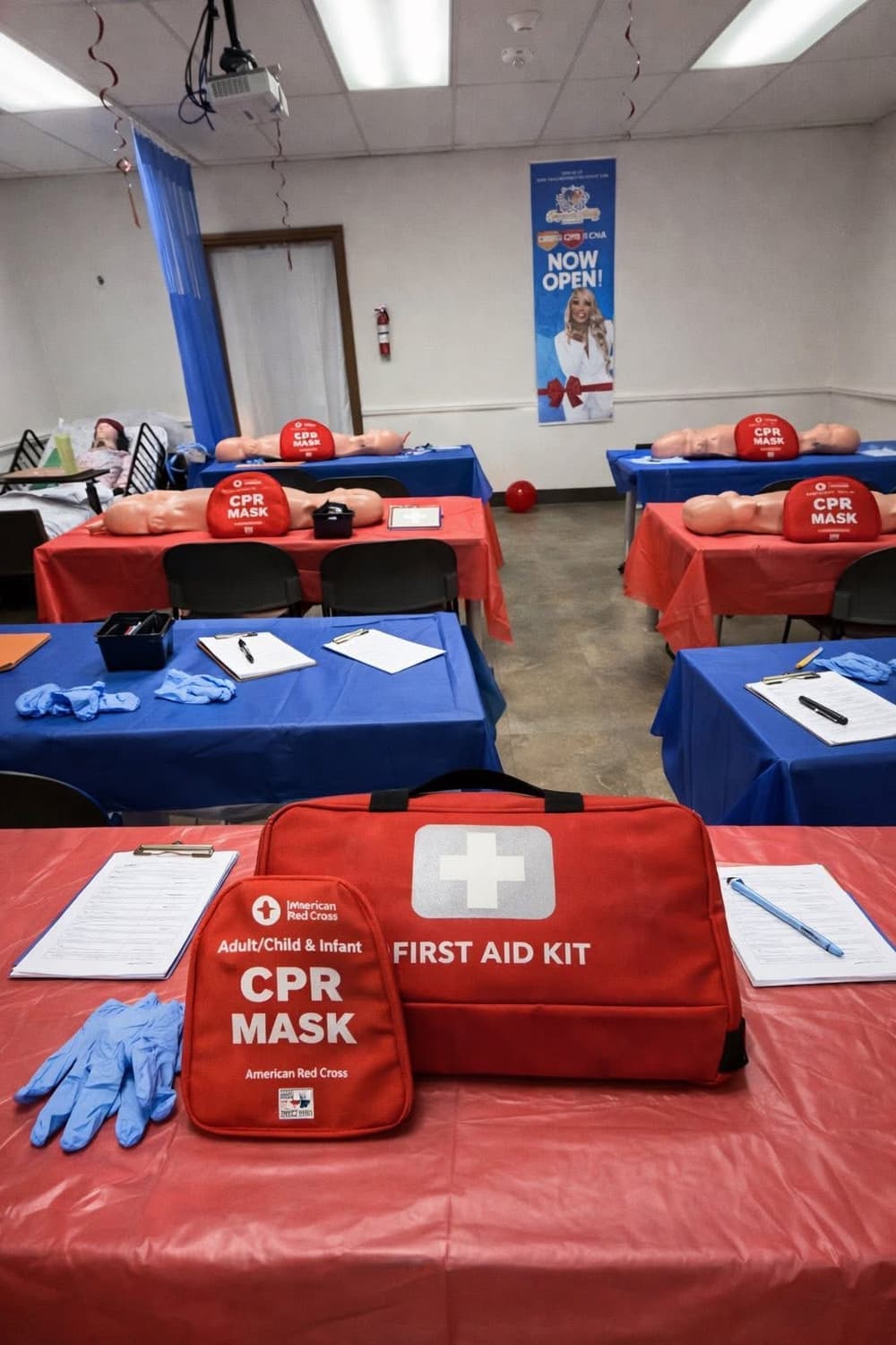The Capitol Drive classroom in Milwaukee set up for CPR training, with Red Cross CPR masks, a first aid kit, and practice manikins on the tables.